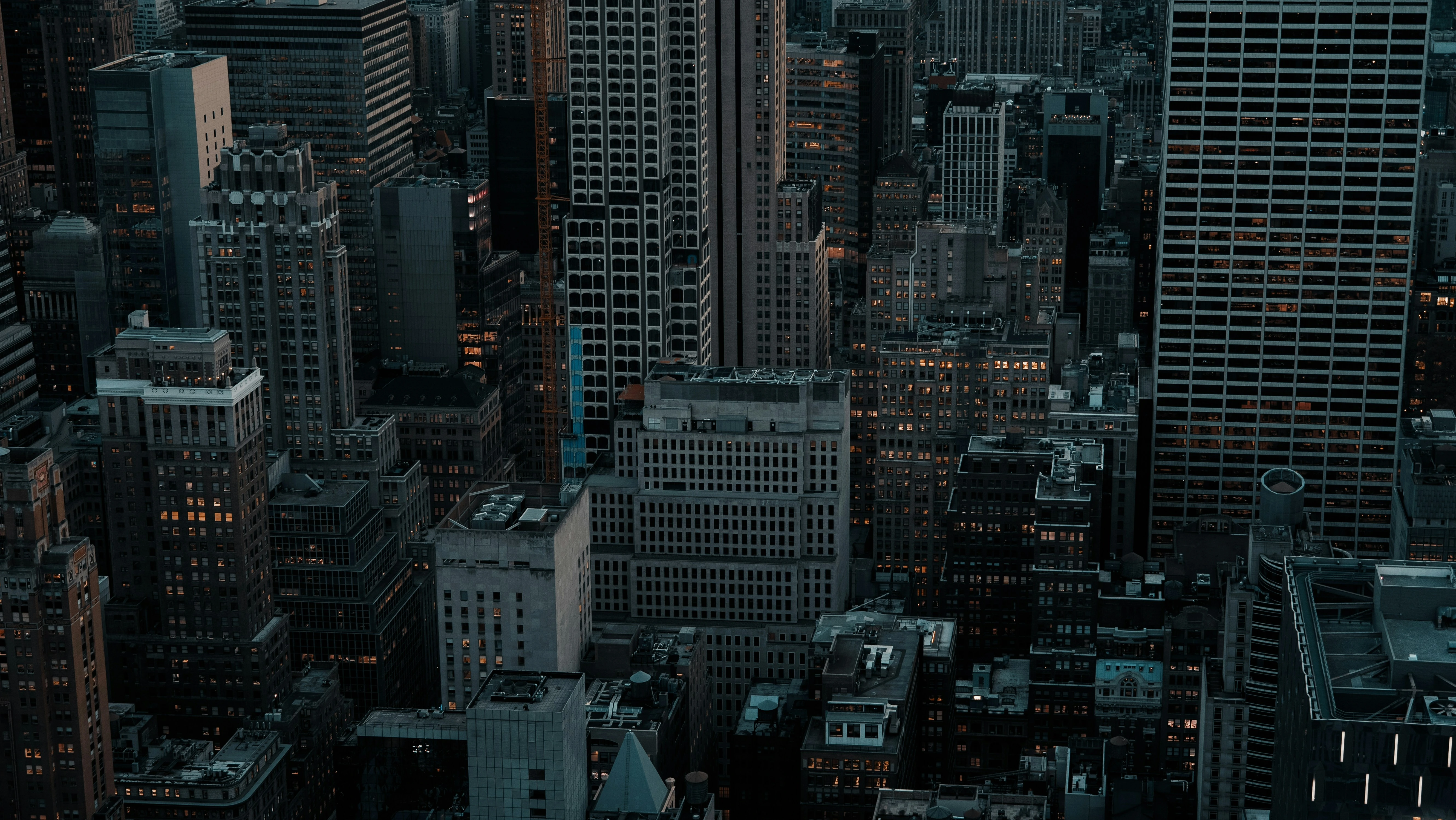 Evening city skyline with illuminated buildings representing global corporate opportunities.