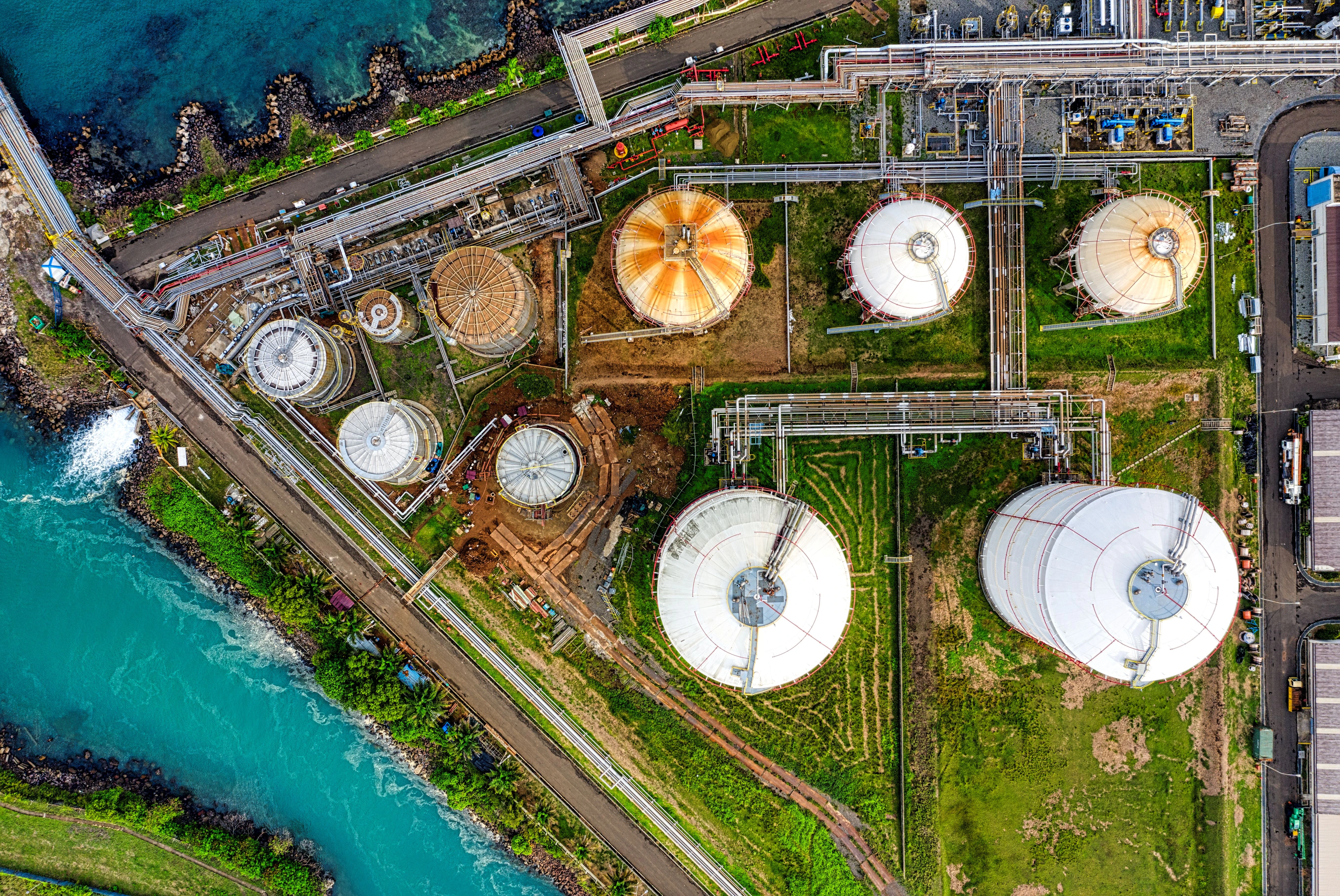 Aerial view of industrial oil storage tanks representing Saudi Arabia's energy and infrastructure sector.